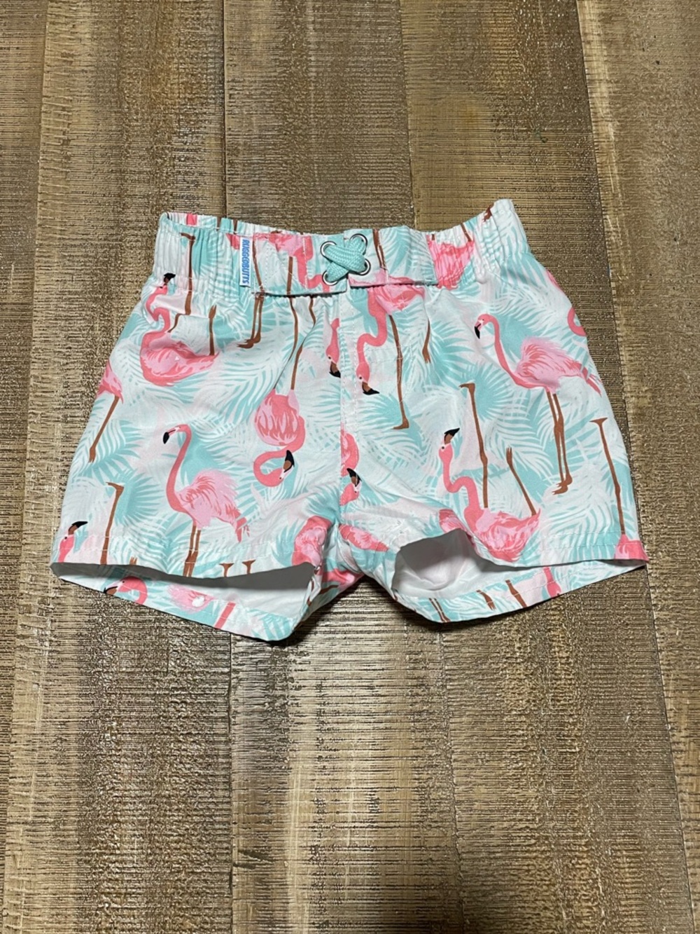 Rugged Butts Baby Swim Trunks with Flamingo Print